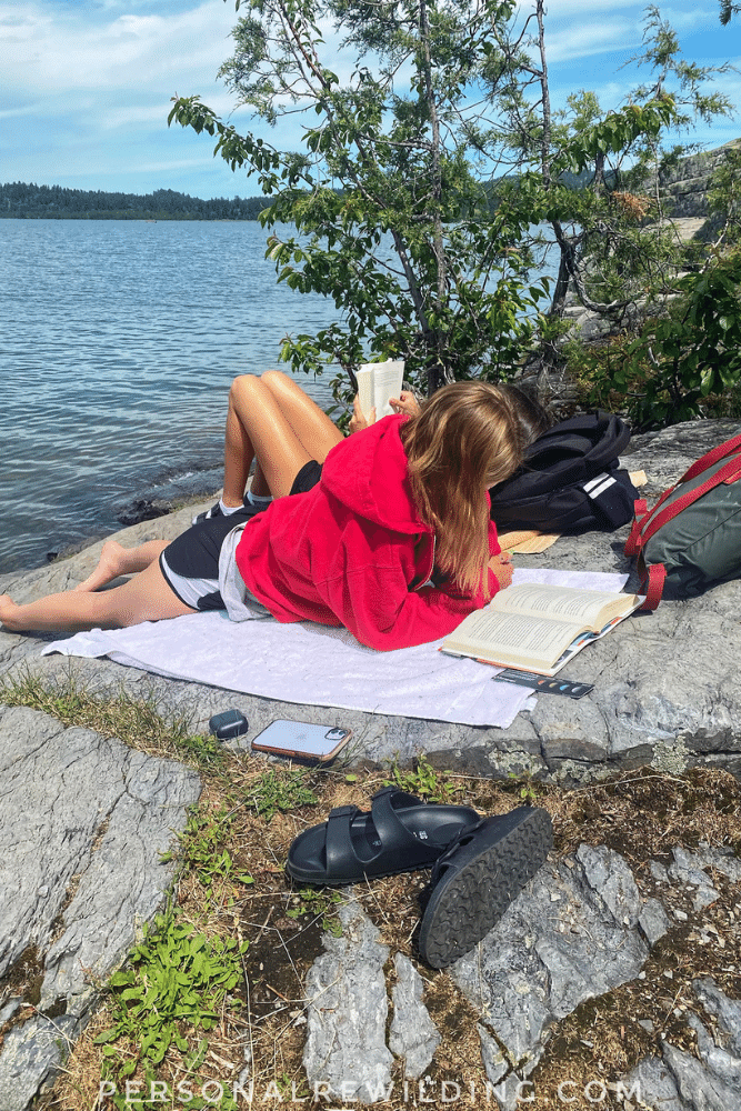 Reading outside in nature by a lake